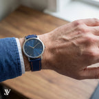Navy Blue Orange Epsom Classic Leather Watch Strap — shown on watch (AI-generated scene)